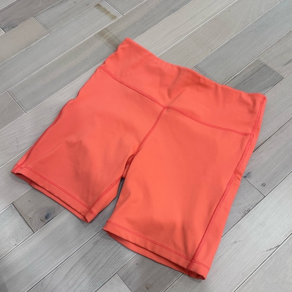 Athleta Ultimate Stash pocket 7” short orange - Picture 1 of 5